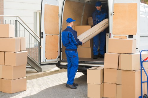 Team preparing a van load safely before transport