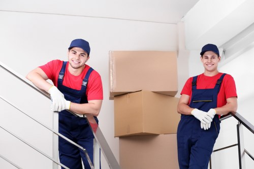 Family preparing for a house move in Enfield with labeled boxes