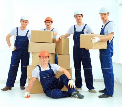 Family preparing belongings for removal truck hire