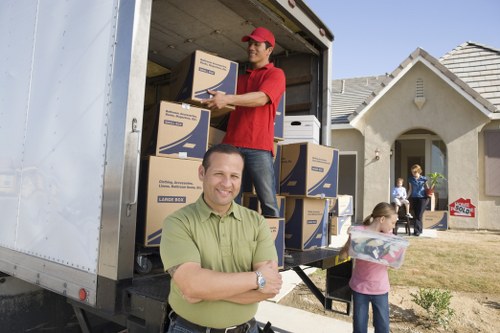 Careful wrapping and labelling of household items during an Enfield packing service