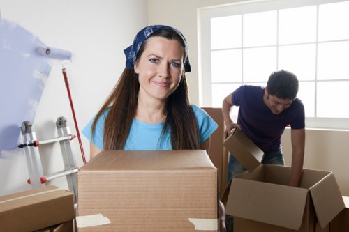 Packed moving boxes and wrapped household items ready for transport