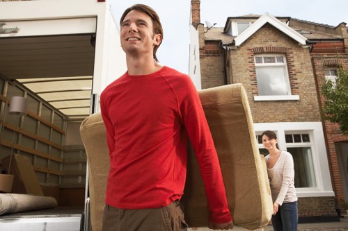 Packed moving boxes and furniture ready for local removal in Enfield