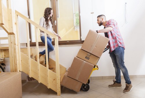 Loading household items into a van for an Enfield move