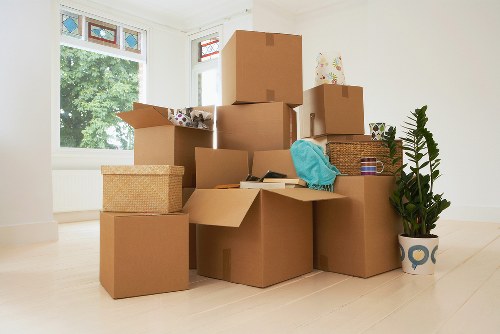 Team unloading office items at a new workspace in Enfield