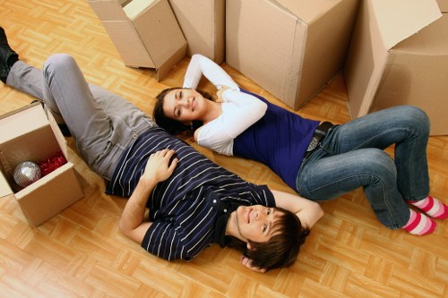 Packed moving boxes and careful furniture protection for Enfield home relocation