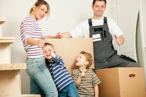 Loading furniture for a move in Enfield residential street